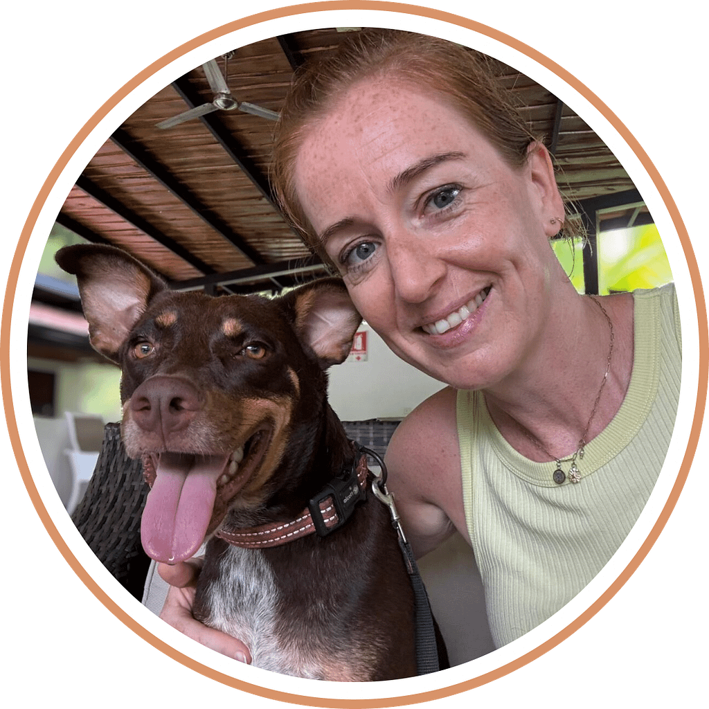 Volunteer with arm around dog