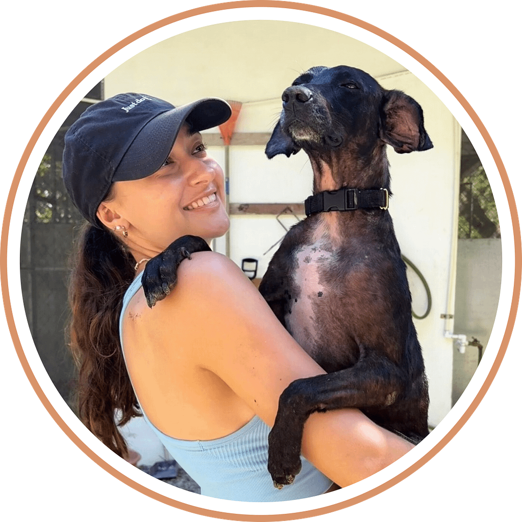 Volunteer holding a dog named Chomp