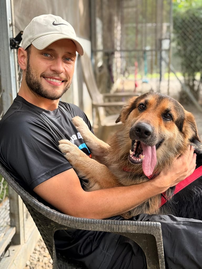 Tyler and guy smiling for the camera